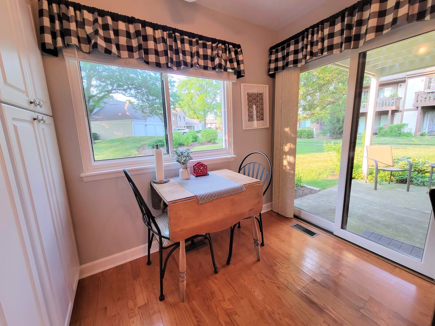 1326 7 Pines Road, Unit D1 Schaumburg, IL 60193 - Photo 12 of 25 a view of a dining room with furniture window and wooden floor