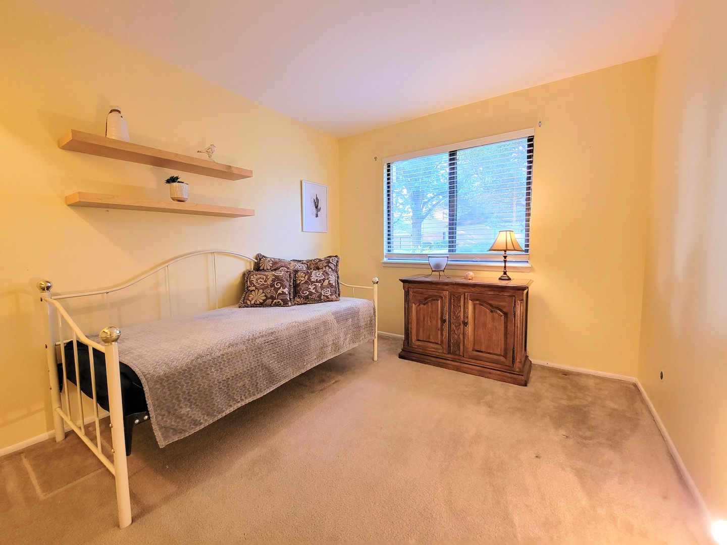 1326 7 Pines Road, Unit D1 Schaumburg, IL 60193 - Photo 19 of 25 a bedroom with a bed and a cabinets