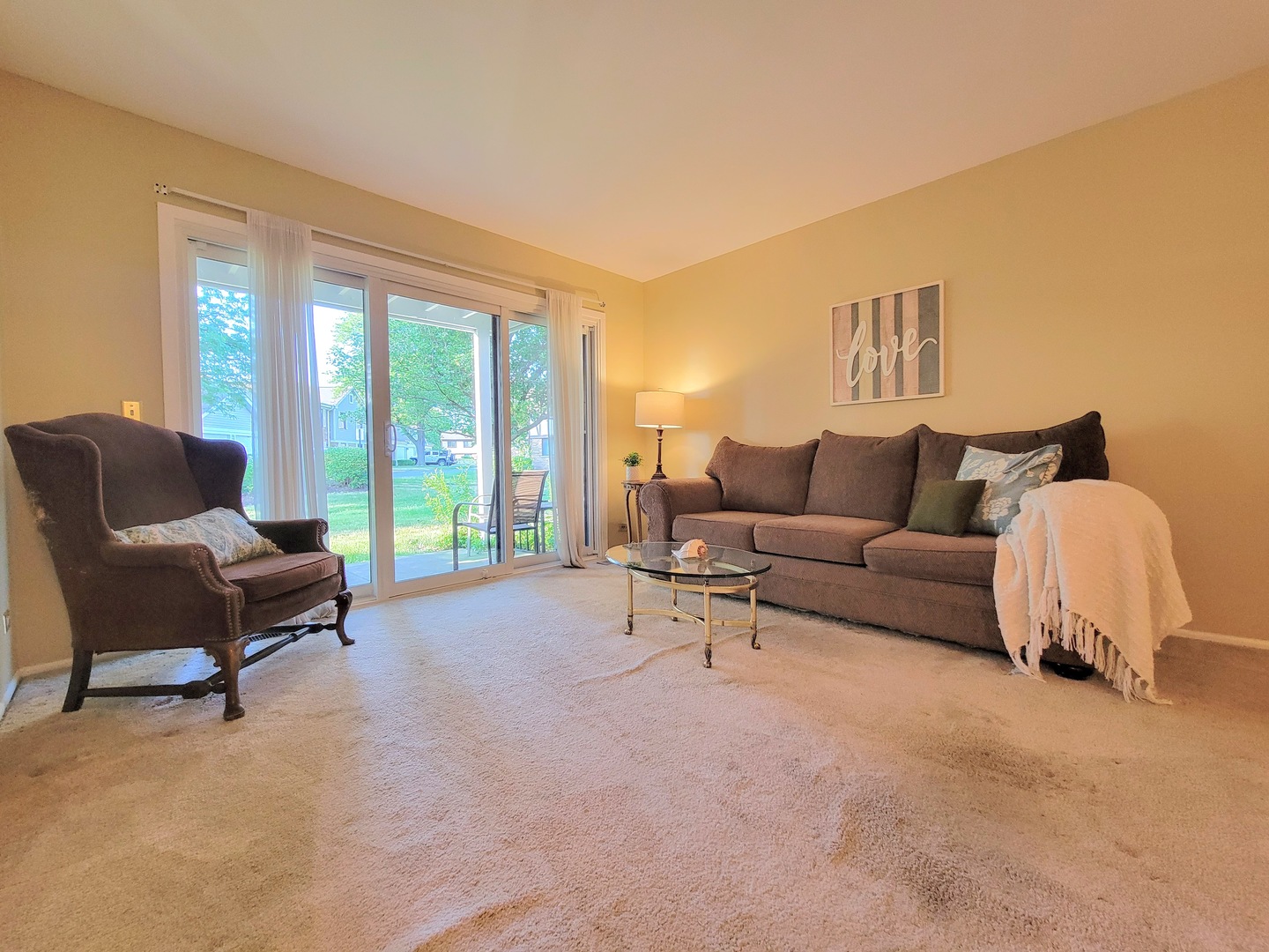 1326 7 Pines Road, Unit D1 Schaumburg, IL 60193 - Photo 3 of 25 a living room with furniture and a large window