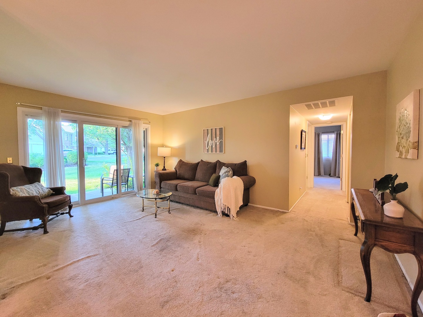 1326 7 Pines Road, Unit D1 Schaumburg, IL 60193 - Photo 5 of 25 a living room with furniture and large windows