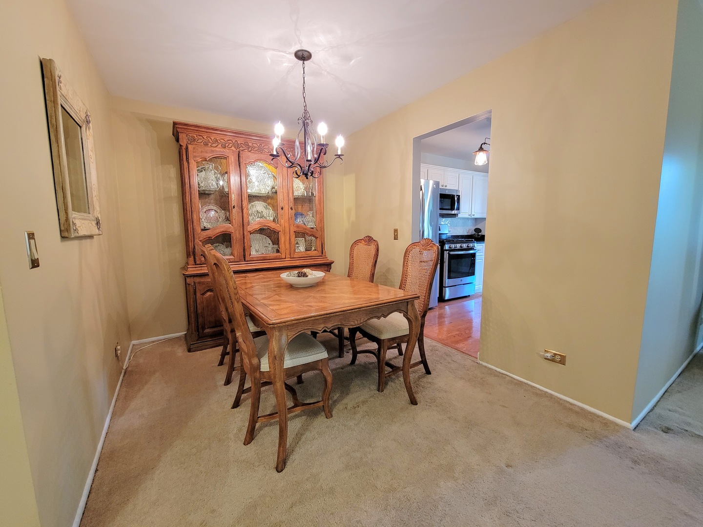 1326 7 Pines Road, Unit D1 Schaumburg, IL 60193 - Photo 7 of 25 a view of a dining room with furniture and chandelier