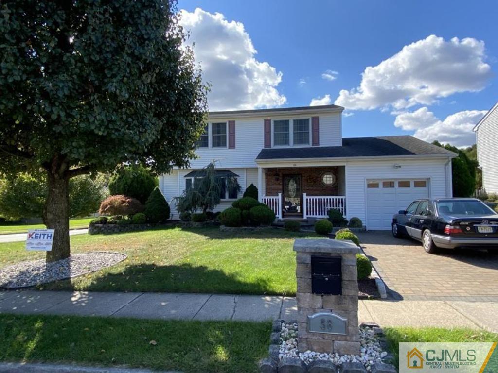 58 Brookside Road Edison, NJ 08817 - Photo 2 of 34 a front view of a house with garden