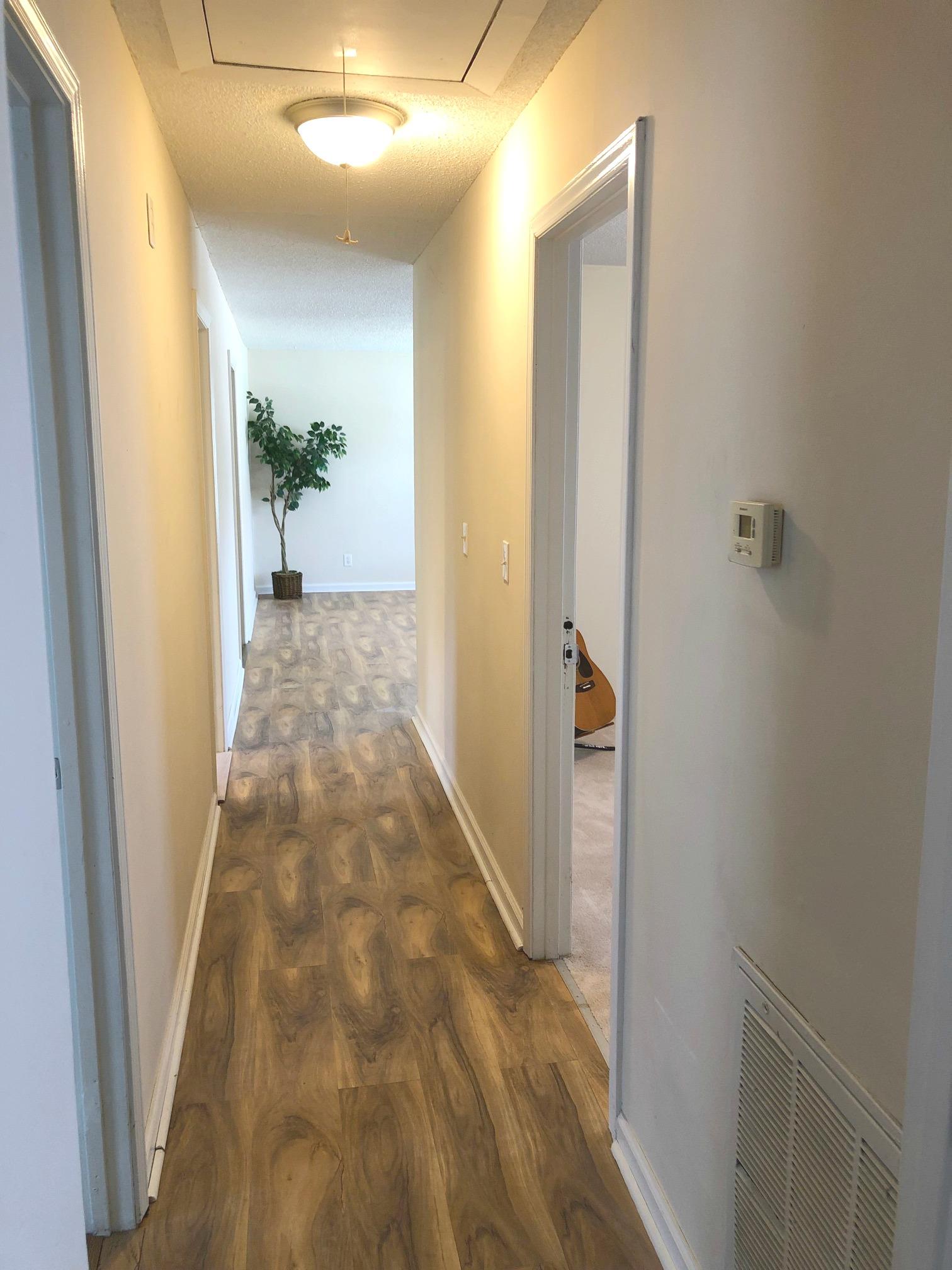 3 Cable Road Oak Grove, KY 42262 - Photo 11 of 17 a view of a hallway with wooden floor and a bathroom