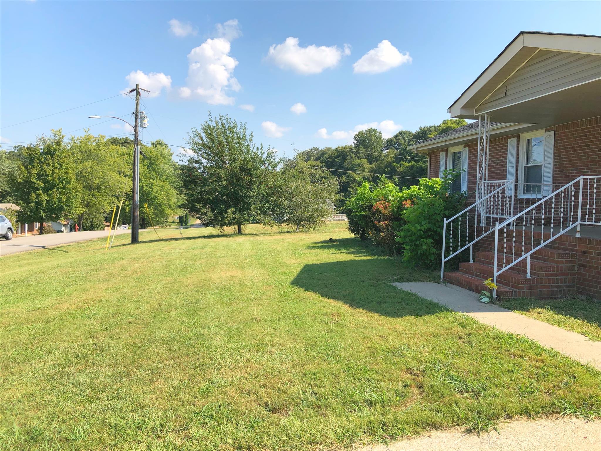 3 Cable Road Oak Grove, KY 42262 - Photo 17 of 17 a view of a house with a backyard and a tree