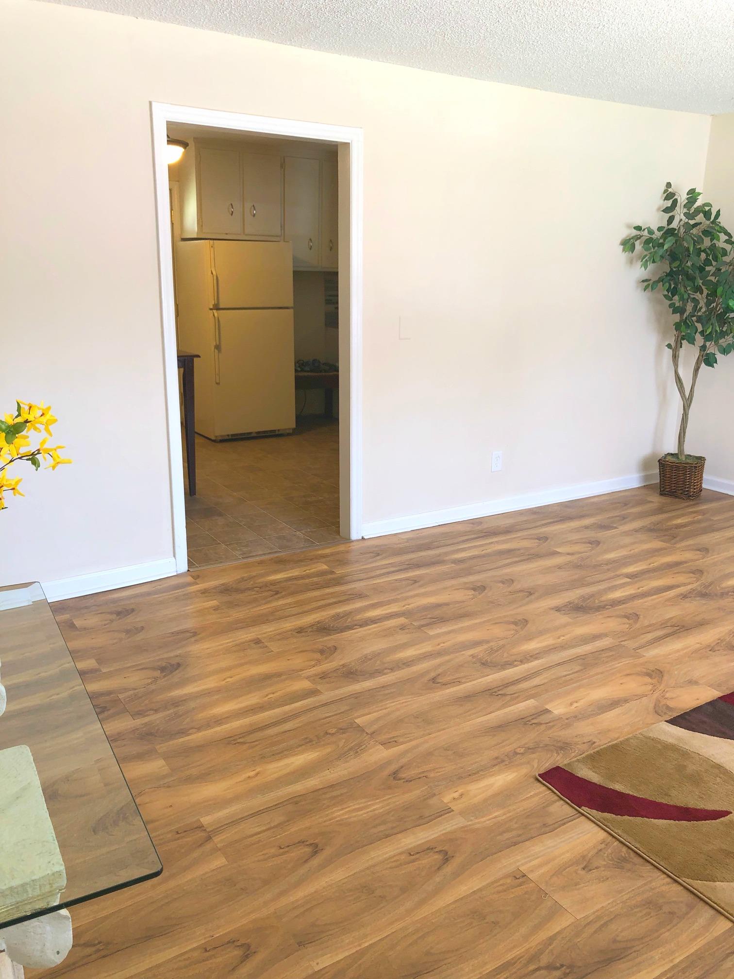 3 Cable Road Oak Grove, KY 42262 - Photo 7 of 17 a view of an empty room with potted plant and wooden floor