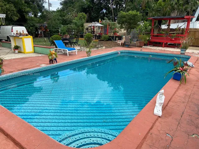 a bedroom with a bed and a mirror