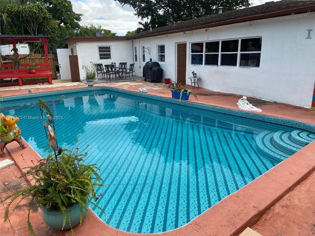 a view of a chairs on wooden deck