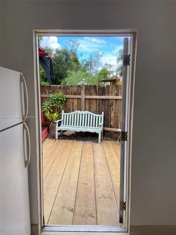 a kitchen with granite countertop a stove and cabinets