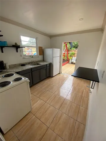 swimming pool view with a seating space