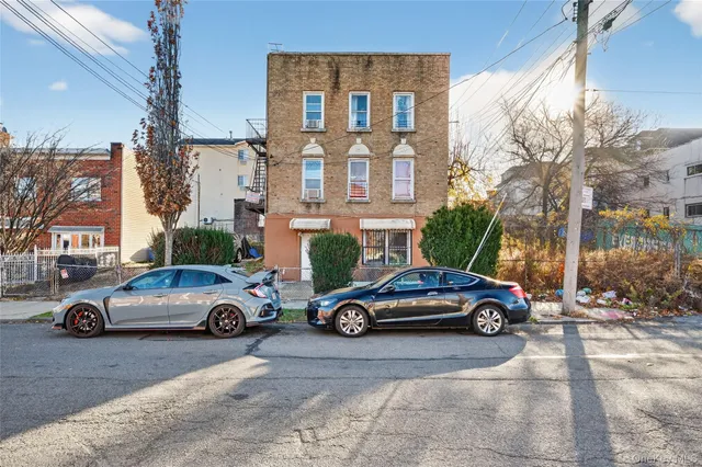a front view of a house with parking