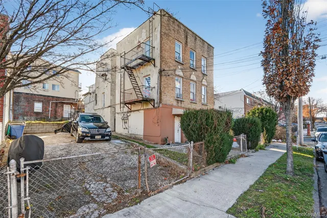 a view of a building with sitting area