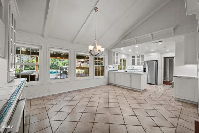 a view of empty room with wooden floor and fireplace