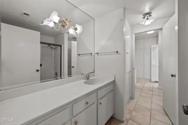 a view of room with window and ceiling fan