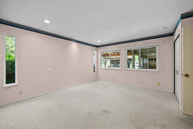 a view of an empty room with a window