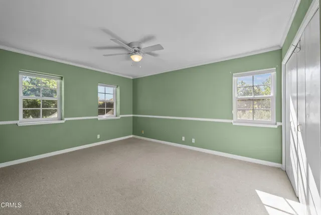 a view of a swimming pool with a yard