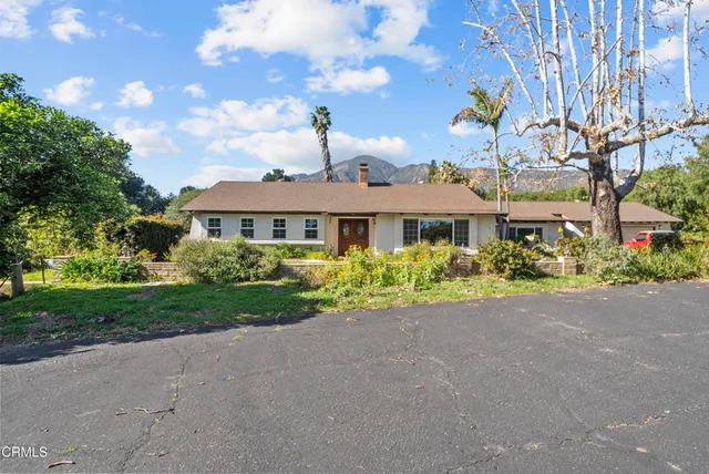 a view of a livingroom with furniture window and wooden floor
