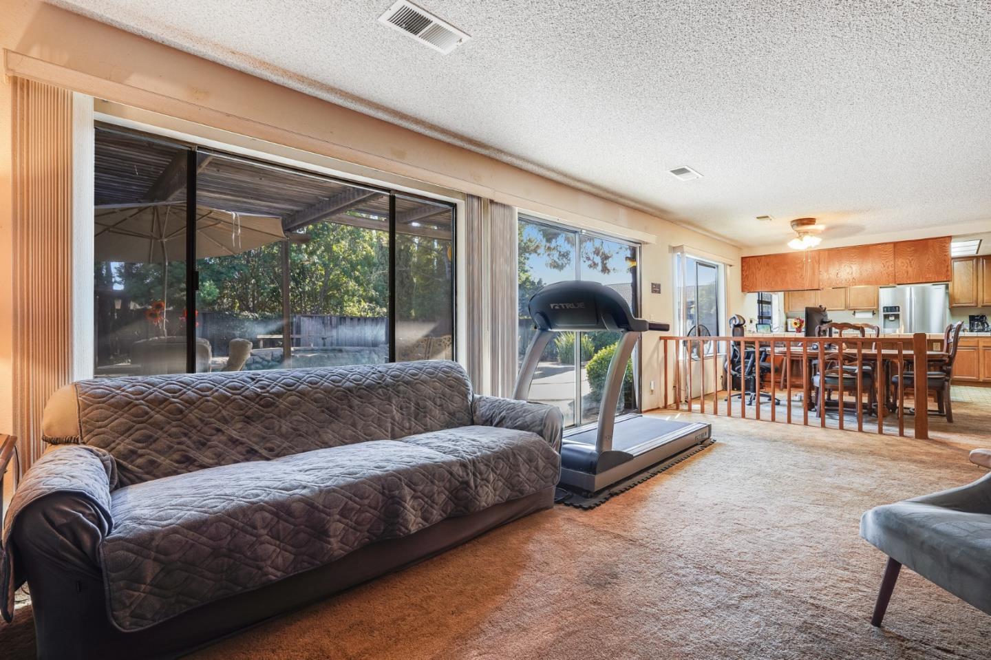 2838 Mantis Drive San Jose, CA 95148 - Photo 14 of 48 a living room with furniture and a flat screen tv