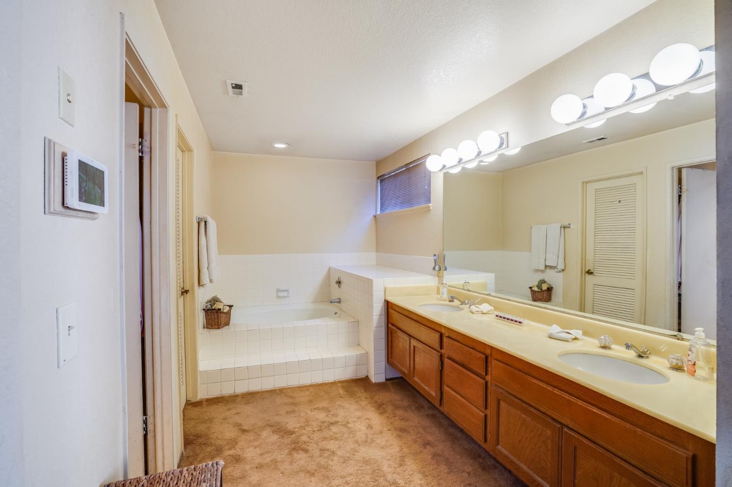 2838 Mantis Drive San Jose, CA 95148 - Photo 23 of 48 a spacious bathroom with a double vanity sink mirror and bathtub