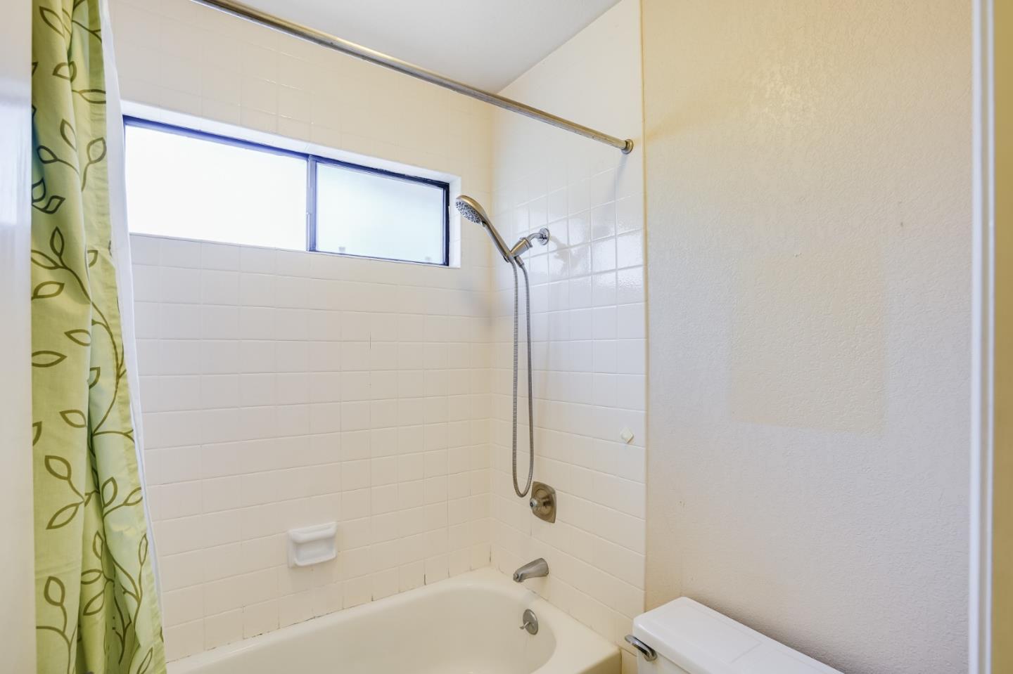 2838 Mantis Drive San Jose, CA 95148 - Photo 31 of 48 a bathroom with a bathtub and shower