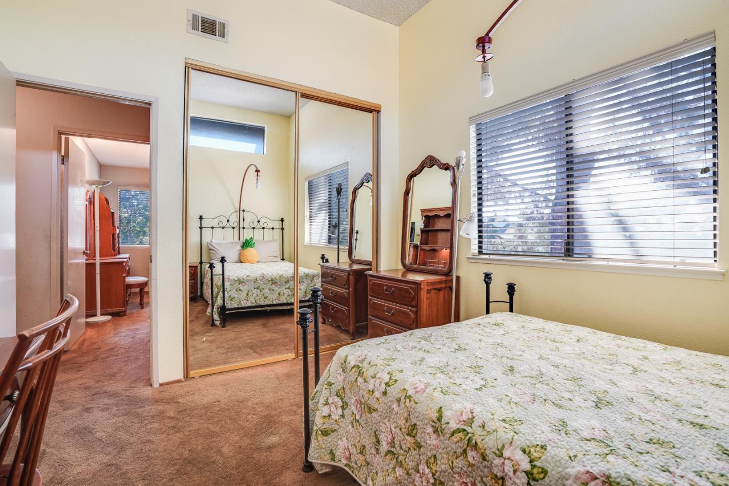 2838 Mantis Drive San Jose, CA 95148 - Photo 34 of 48 a bedroom with a large bed and a large window