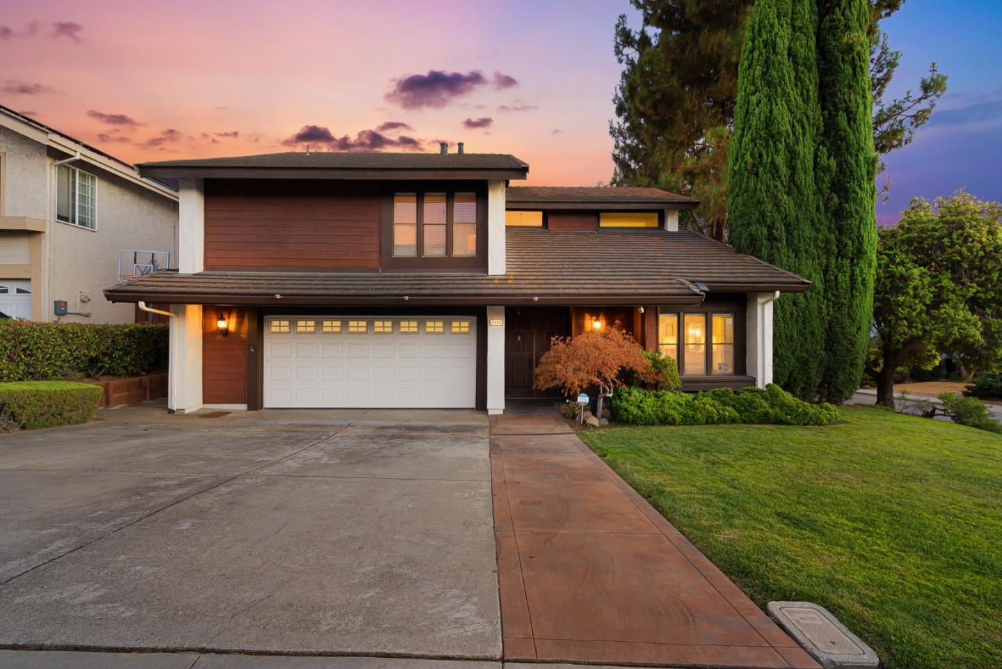 2838 Mantis Drive San Jose, CA 95148 - Photo 45 of 48 a front view of a house with a yard and garage