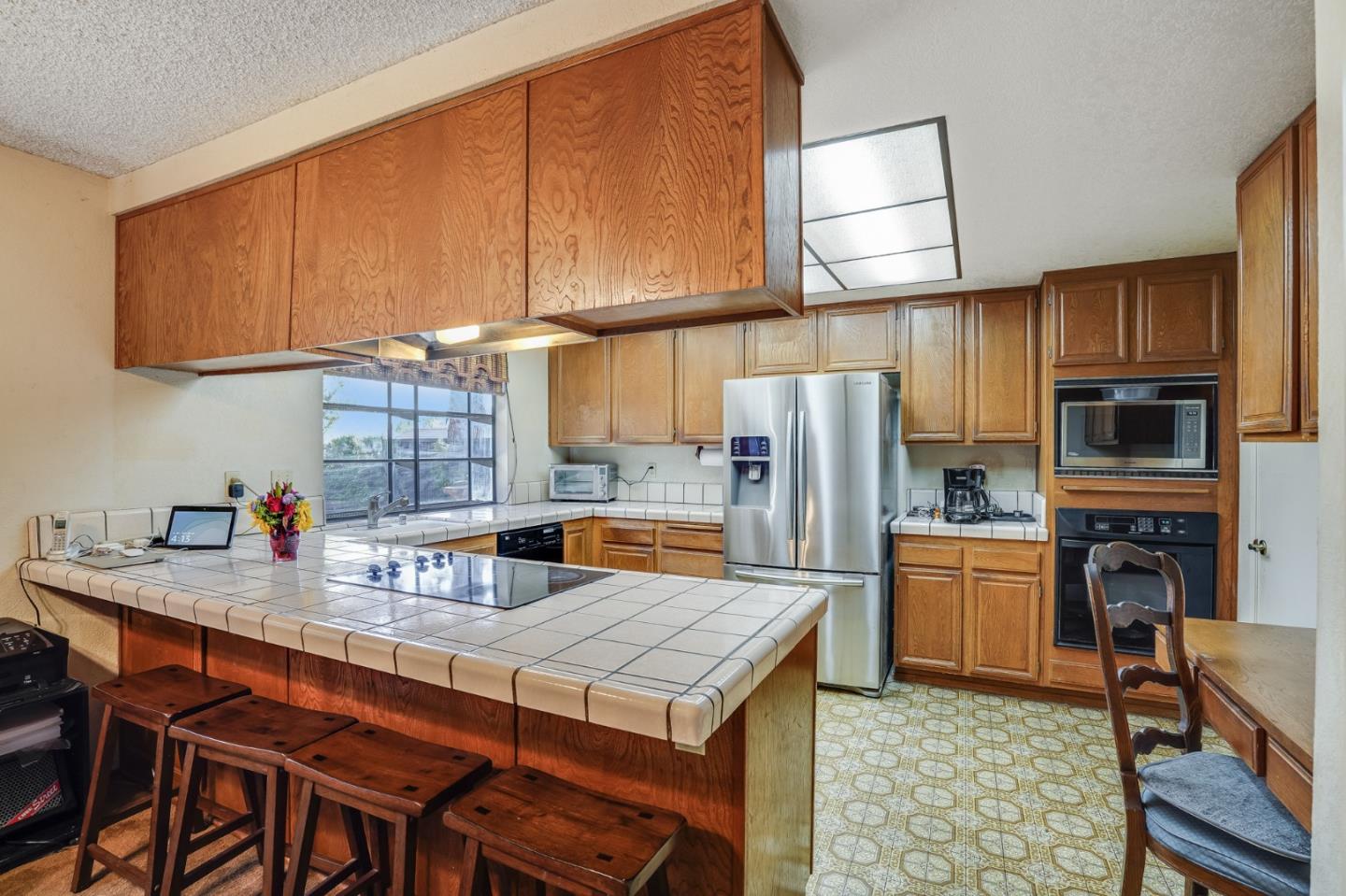 2838 Mantis Drive San Jose, CA 95148 - Photo 10 of 48 a kitchen with a refrigerator a stove a sink and cabinets
