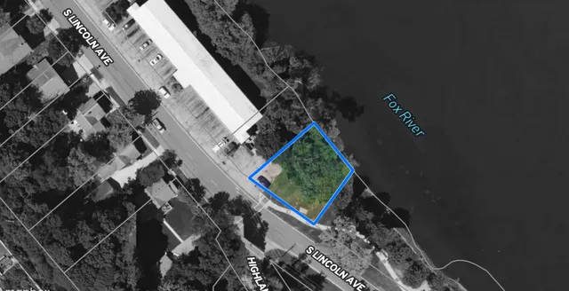 a view of a street with a building in the background