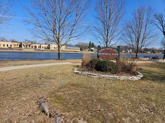 a view of a backyard with large trees