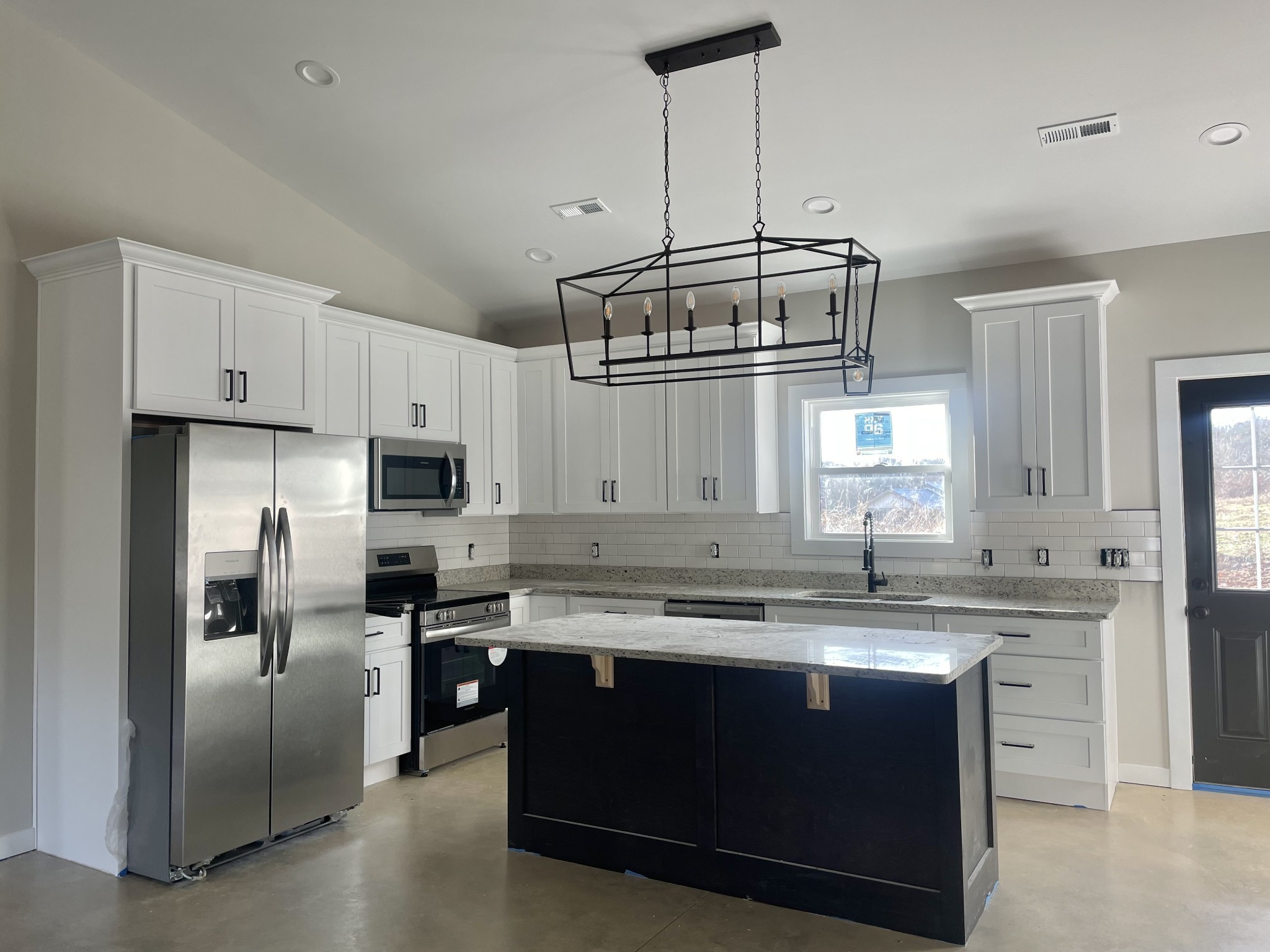 1122 Ruby Road Lewisburg, TN 37091 - Photo 7 of 7 a kitchen with kitchen island a sink stove and refrigerator
