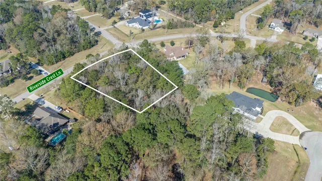 a aerial view of a house with a yard