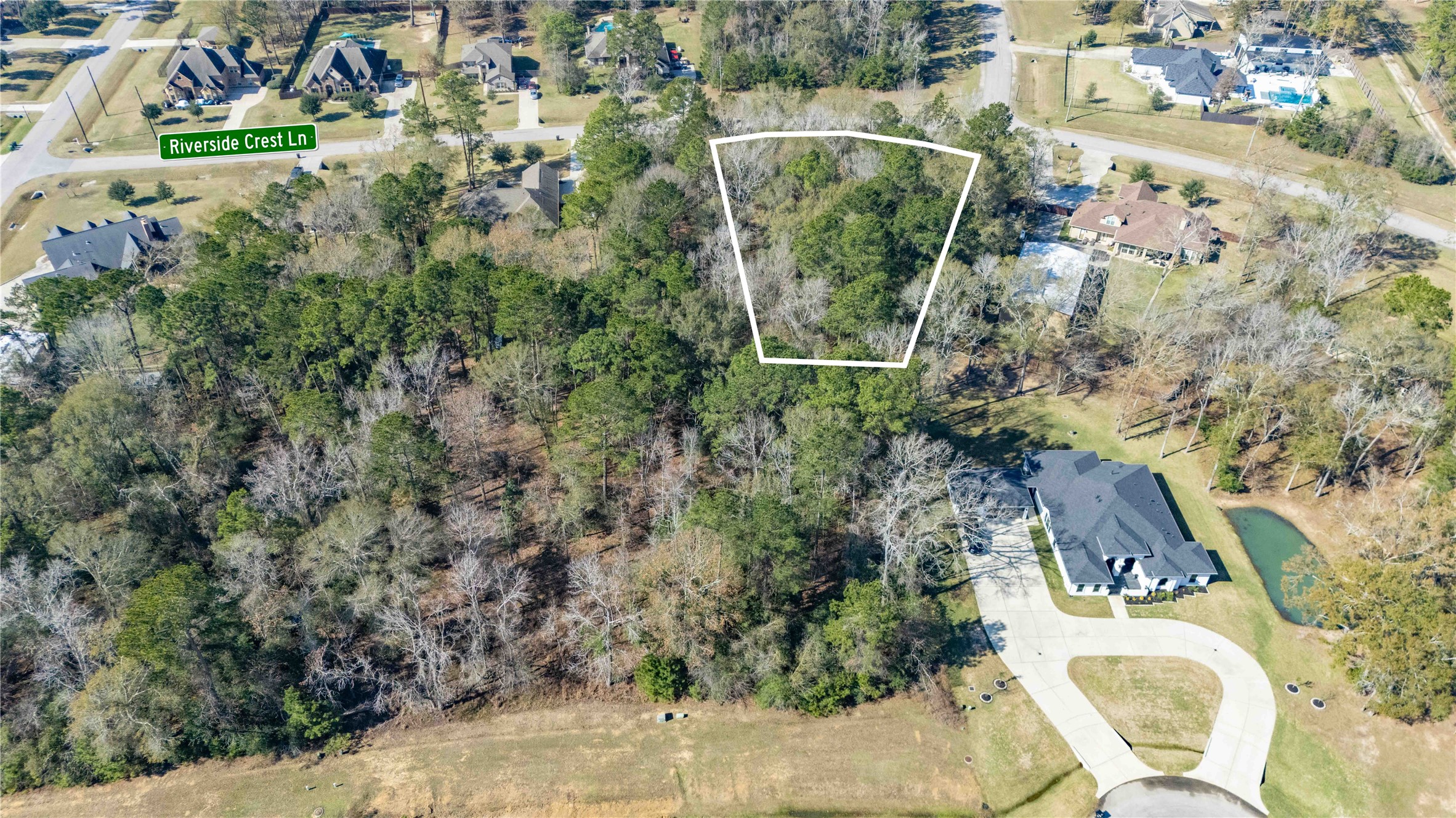 28518 Riverside Crest Lane Huffman, TX 77336 - Photo 3 of 6 an aerial view of a house with a yard and large trees
