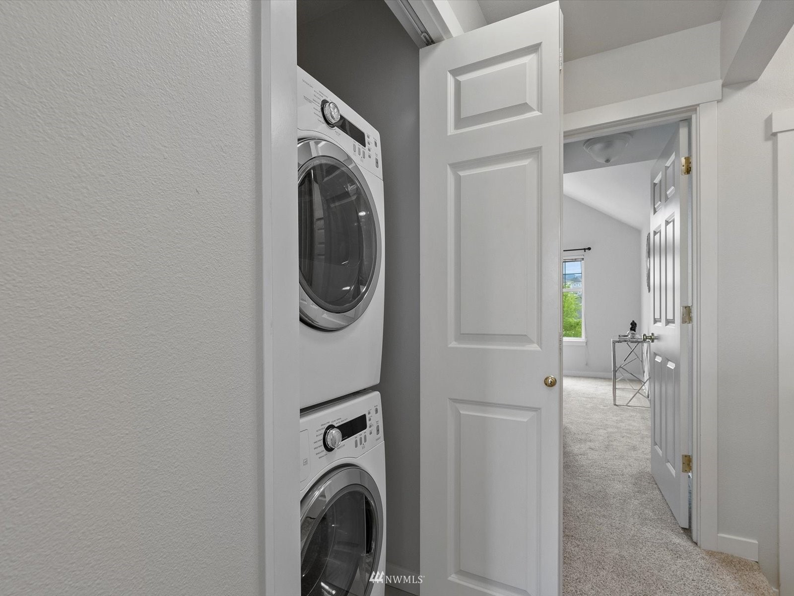 1391 Huckleberry Circle Issaquah, WA 98029 - Photo 19 of 32 a view of a hallway with washer and dryer