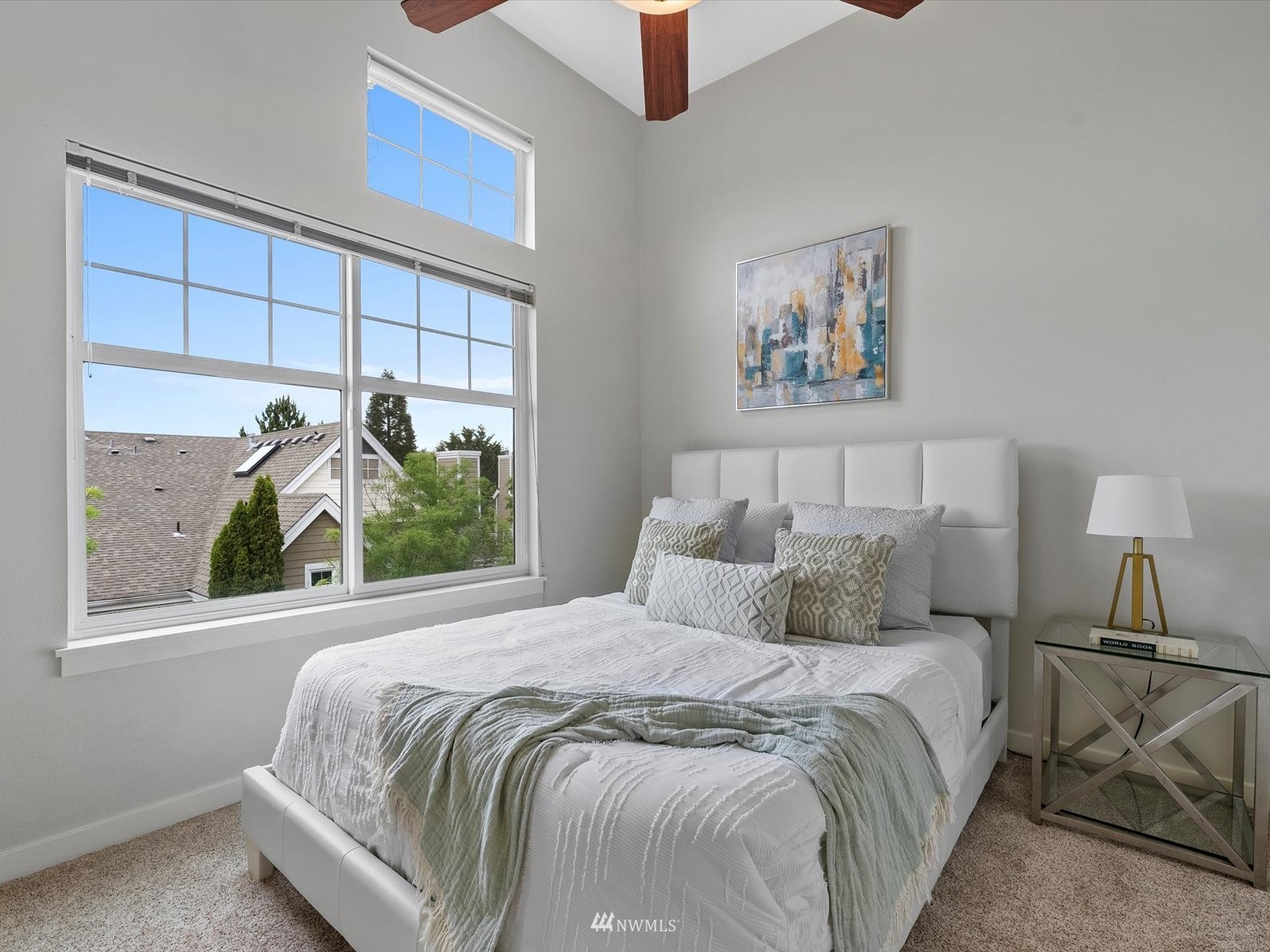 1391 Huckleberry Circle Issaquah, WA 98029 - Photo 20 of 32 a bedroom with a bed and a painting on the wall