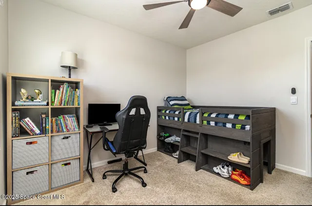 a view of a workspace with furniture