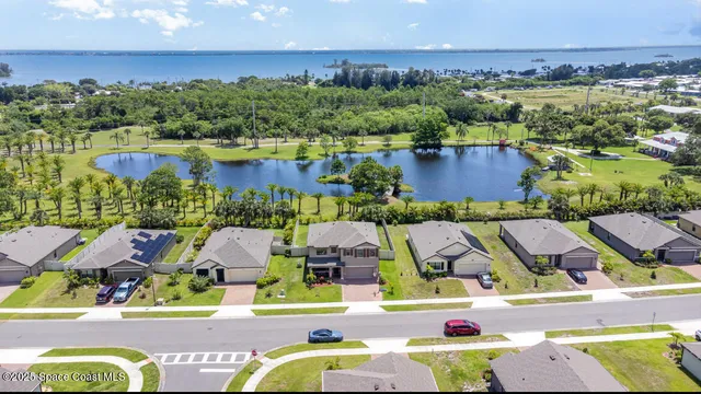a view of houses with outdoor space and swimming pool
