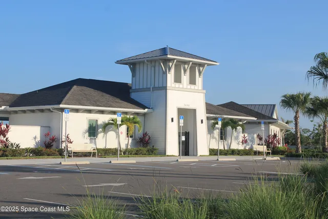 a view of a house and a yard