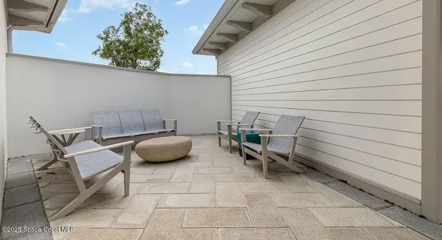 a backyard of a house with seating space