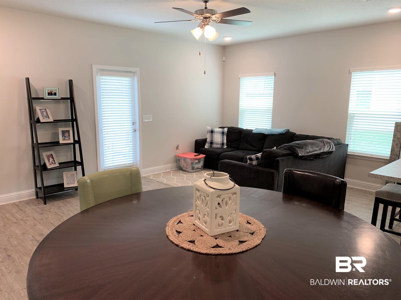 25806 Pollard Road, Unit 66 Daphne, AL 36526 - Photo 9 of 30 Dining to Living Area