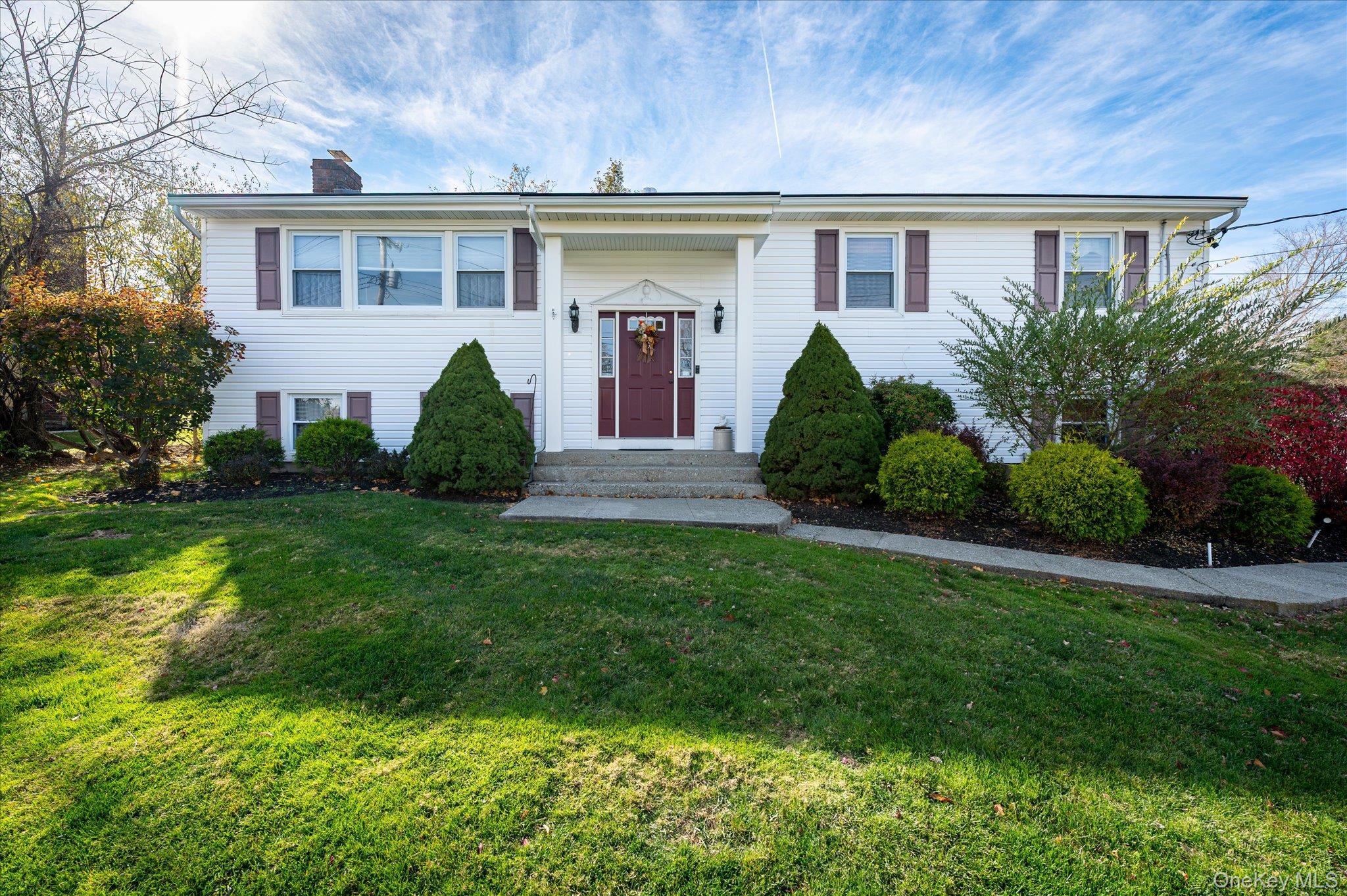 523 Manchester Road Yorktown Heights, NY 10598 - Photo 1 of 1 a front view of a house with a yard and potted plants