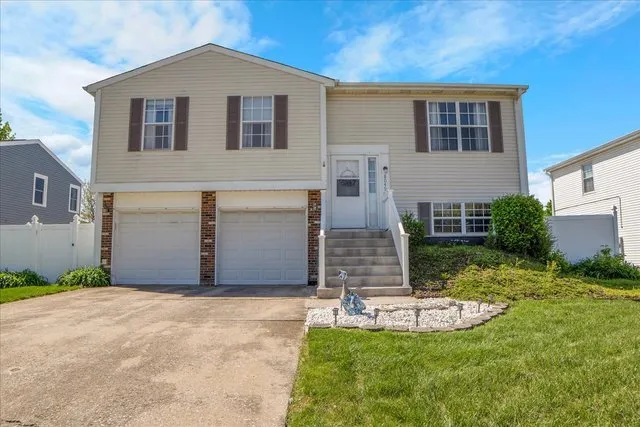 a front view of house with yard