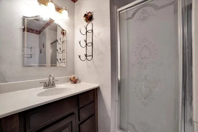 a bathroom with a sink and a mirror