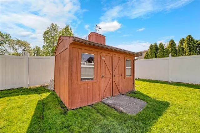 a view of an house with backyard space and garden
