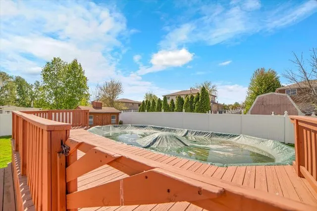 a view of a balcony with floor to ceiling windows