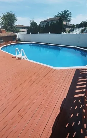 a view of a house with roof deck and garden