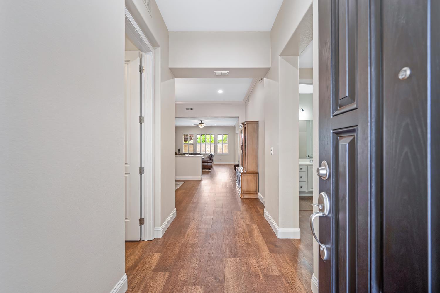 5966 Tanus Circle Rocklin, CA 95677 - Photo 11 of 38 a view of a hallway with wooden floor