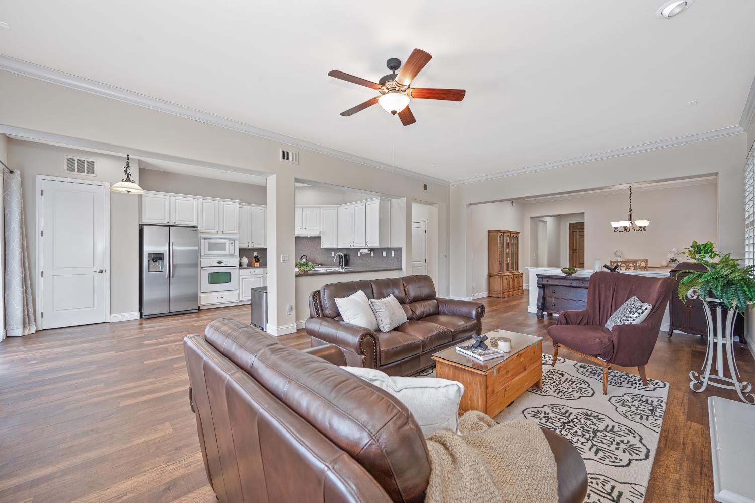 5966 Tanus Circle Rocklin, CA 95677 - Photo 16 of 38 a living room with furniture kitchen view and a refrigerator