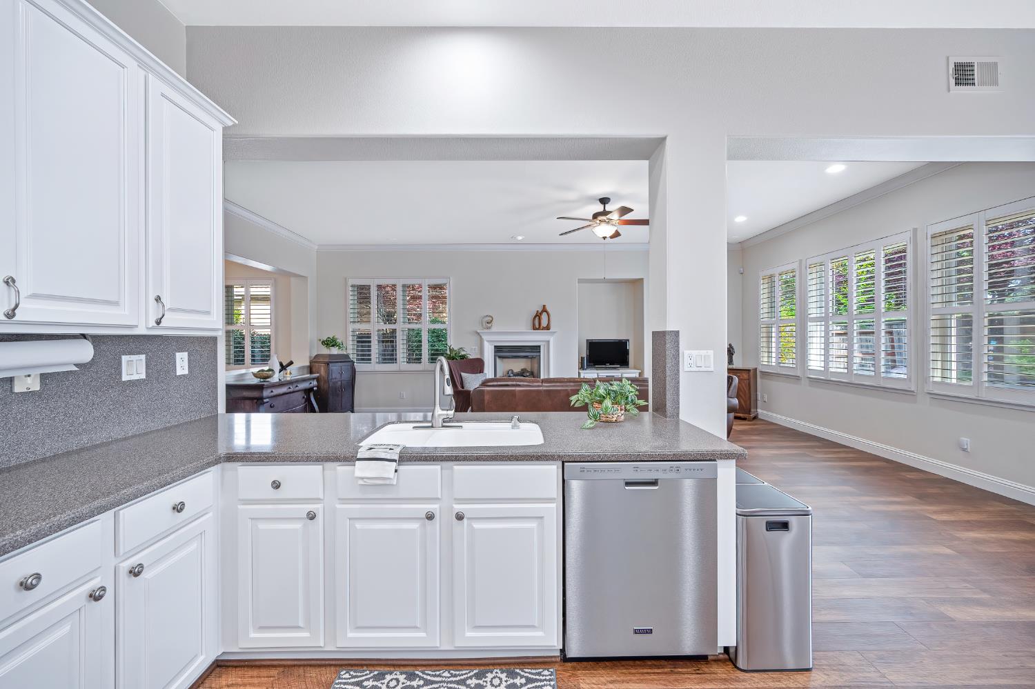 5966 Tanus Circle Rocklin, CA 95677 - Photo 2 of 38 a kitchen with white cabinets and sink