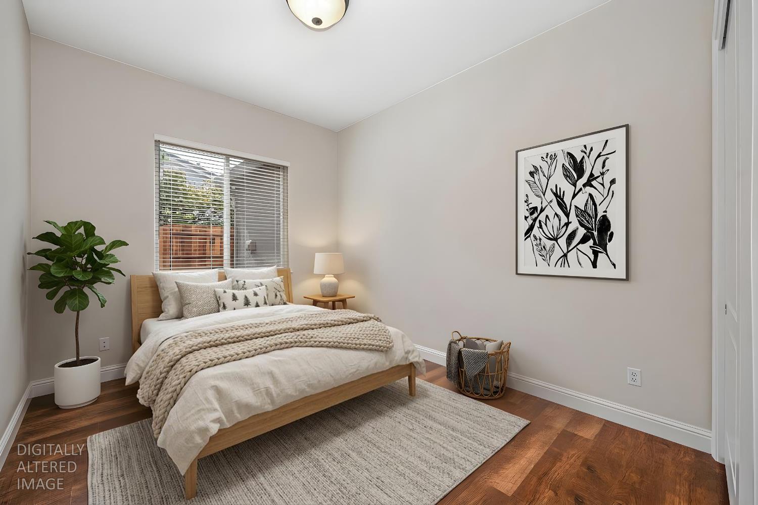 5966 Tanus Circle Rocklin, CA 95677 - Photo 26 of 38 a bedroom with a large bed and a potted plant