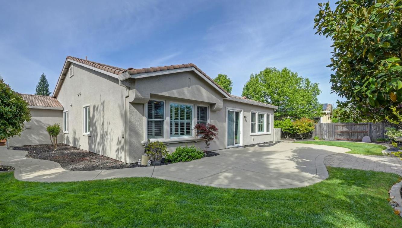 5966 Tanus Circle Rocklin, CA 95677 - Photo 30 of 38 a front view of a house with a yard and potted plants