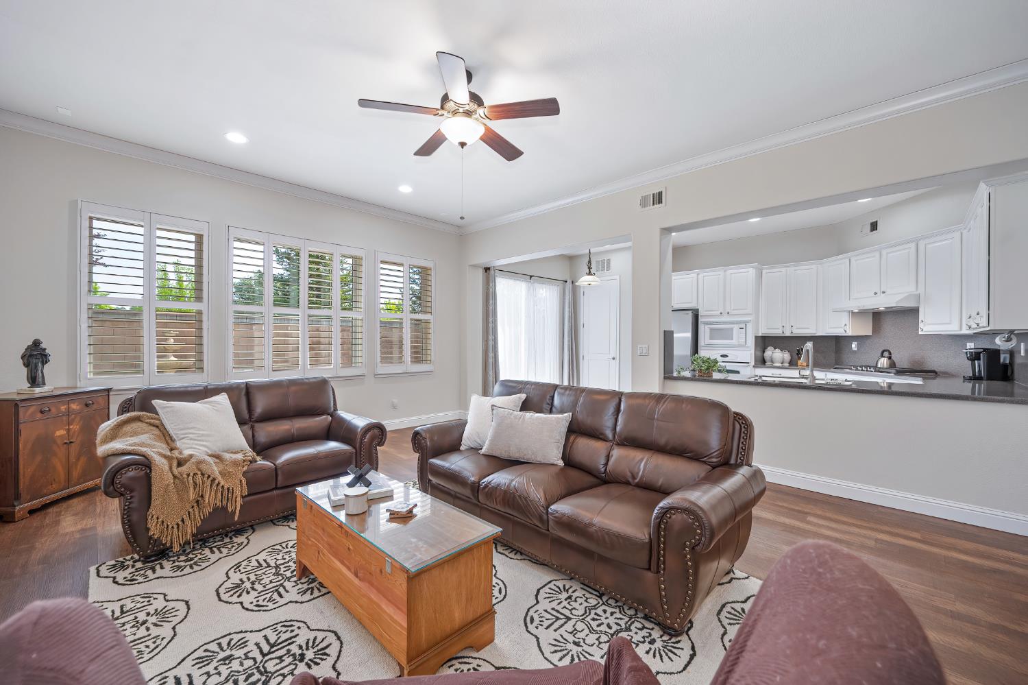 5966 Tanus Circle Rocklin, CA 95677 - Photo 3 of 38 a living room with furniture ceiling fan and a window